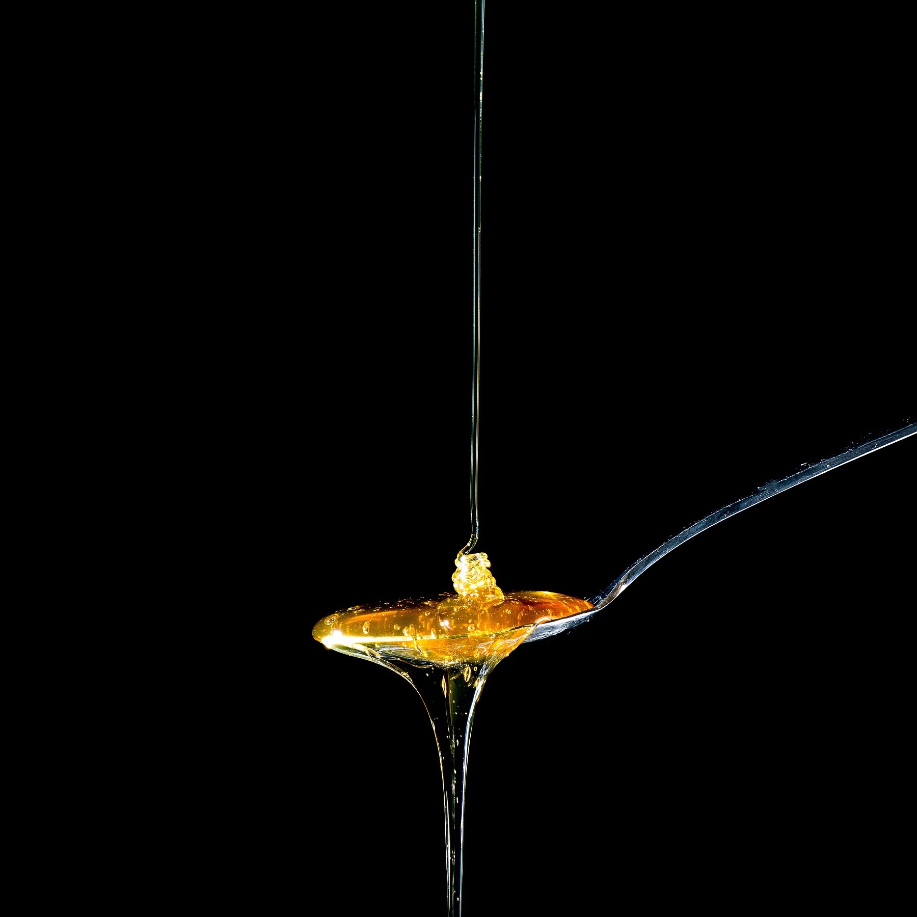 spoon with overflowing honey